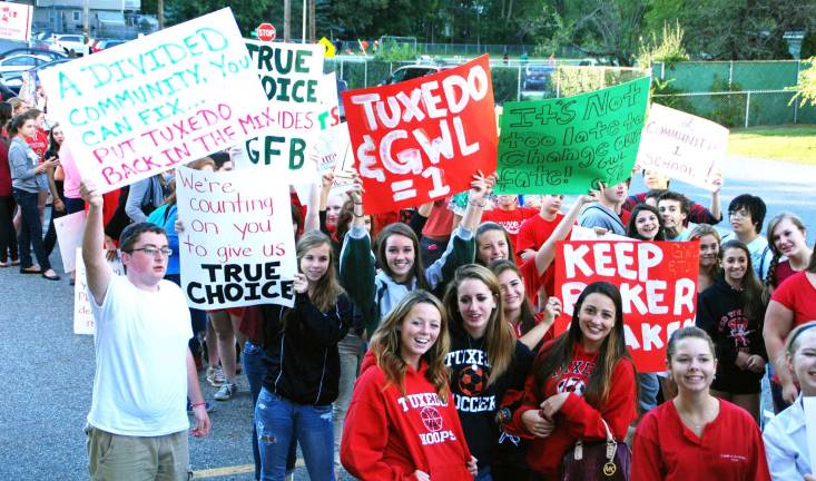 The ‘walk for choice’ Photo by Ed Bailey Tuxedo students hold their signs at the back door of the Greenwood Lake Elementary School waiting to be let into Wednesday's school board meeting.