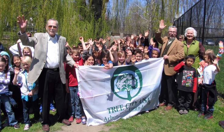 Village of Warwick celebrates Arbor Day Photo by Roger Gavan Shade Tree Commissioner Roger Metzger (left) and Mayor Michael Newhard, standing with guest speaker Patricia Reinhardt, a member of the Warwick Valley Gardeners, reported that Warwick had been named a ìTree City, USAî for 30 consecutive years.