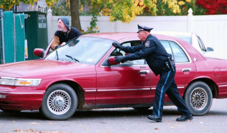 In Sandy’s wake Photo by Ed Bailey A driver waiting in line for gasoline last Saturday ran out of it before he could reach the pump. He got a hand from a Greenwood Lake Police.