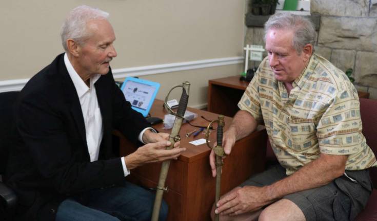 Rand-tiques Roadshow raises $600 to support Seward/Mapes Homestead Restoration Photo by Roger Gavan Appraiser and auctioneer William J. Jenack discusses his estimated value of antiques with David Fitzgerald.