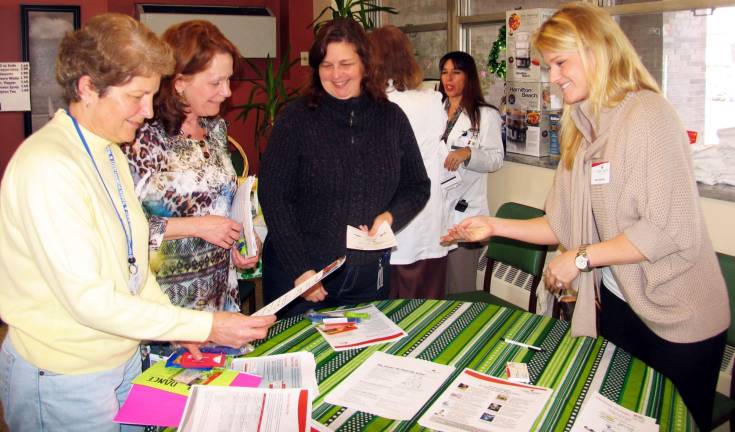 Hospital employees learn small changes can make a big difference Bon Secours business office staff, from left, Gail Williamson, Linda Ridella and Colleen Rispoli collect information about an upcoming "Heart Walk" from Amy Hardisty, special events manager for the American Heart Association.