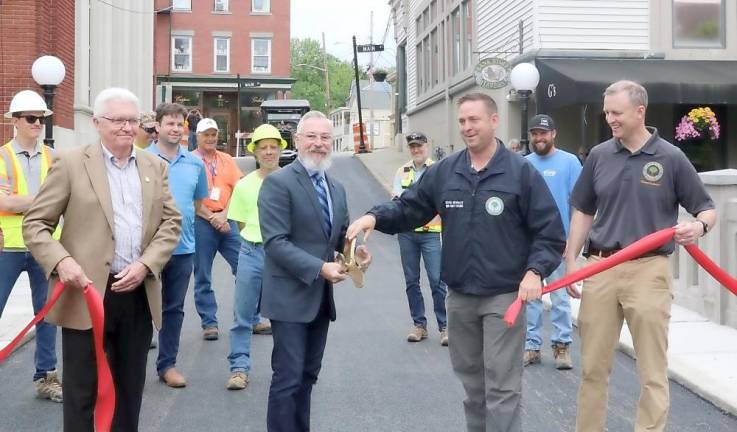 At the ribbon cutting (from left to right) Legislator Barry Cheney, Newhard, Neuhaus and Orange County Commissioner of DPW Erik Denega.