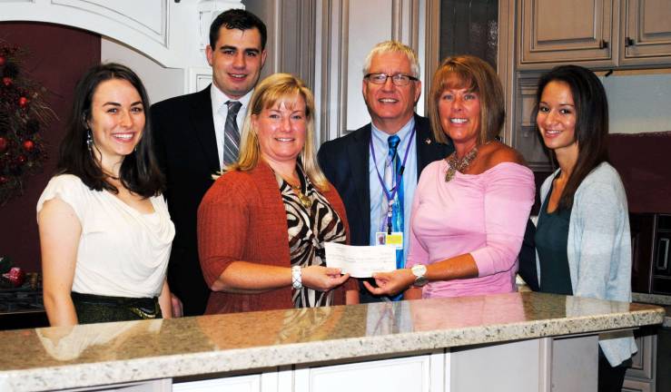 Kitchen and Bath Works cross-supports with Community Vision with $500 check Kitchen and Bath Works, 314 Route 94 South, began the current school year by offering its customers an opportunity to donate $500 toward the school or organization of their choice as part of having a complete kitchen remodeling. On Sept. 18, owner Mechelle Casciotta presented the first check in support of a school to Keely Blaikner, director of the Warwick Valley High School Orchestra. From left, Farrell Brenner, president, Warwick Valley High School (WVHS) Orchestra; Greyson Floss, president, Community Vision; Keely Blaikner, director, WVHS Orchestra; Dr. Raymond Bryant, superintendent, Warwick Valley School District; Michelle Casciotta, owner, Kitchen and Bath Works; and Lauren Armand, secretary, WVHS Orchestra.