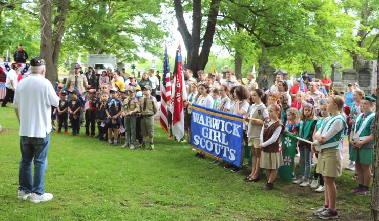 The tradition continues American Legion Post 214 past Commander Walt Parkinson conducted ceremonies and continued a tradition he began years ago by addressing the scouts gathered in the cemetery to teach them the importance of service, not only in the military but in many other ways that contribute to their community and their country.