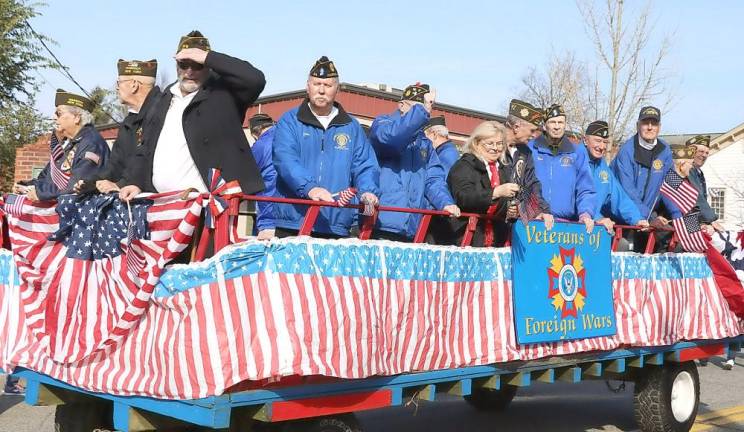 Members of VFW Post 4662 and American Legion Post 215 shared a ride during the parade down Main Street culminating in ceremonies at Veterans Memorial Park.