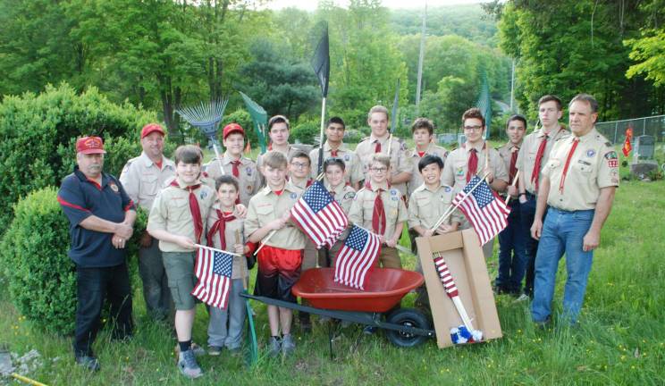 Greenwood Lake remembers and honors Photos by Ed Bailey Boy Scout Troop 121 and members of the Greenwood Lake American Legion placed flags on the graves of veterans buried in the Greenwood Lake Cemetery. Pictured with the scouts are American Legion Commander Gerry Brewer, Scout Master Tommy Holder and Assistant Scout Master Steve Butfilowski.