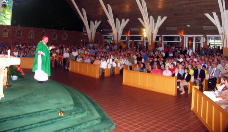 Blessed are the ball players and the gardeners ìThere are so many of you here. This to me is a two-collection crowd,î quipped Cardinal Timothy Dolan as he began his homily before the standing-room-only congregation.