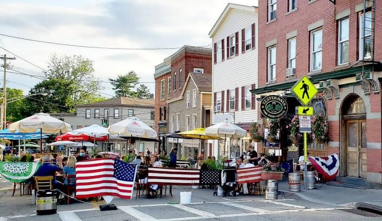 Yesterday’s Restaurant recently included an evening of live musical entertainment to entertain diners at its outdoor tables on Main Street. Village officials are looking to extend outdoor dining through the end of September. Photo by Terry Gavan