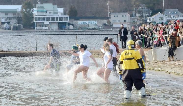 Snow be damned. What was described as one of the largest community events in memory, the Village of Greenwood Lake held a two-day Winter Carnival last weekend at the Thomas P. Morahan Waterfront Park. On land, there were food trucks, live music, games, including axe throwing, and crafts for the young and those somewhat older as well as bonfires on the beach. On Sunday, there also was the GWL Skatepark Polar Plunge. With GWL firefighters wearing protective water rescue equipment acting as in-lake life guards, waves of people stripped down to their bathing suits and ran into the lake. And then more quickly they ran out to the cheers of the large crowd dressed appropriately in warm jackets, gloves and hats. So much for the big chills.