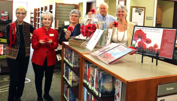 'Knitting Our Warwicks Together' in memory of the veterans of World War I Photo by Roger GavanFrom left, Knitting Our Warwicks Together Coordinator Pat Foxx, Rachel Rivera, president of Warwick VFW Post 4662 Auxiliary, Treasurer Barbara O'Neil, Sesquicentennial. Committee member George Arnott and Albert Wisner Public Library Director Rosemary Cooper.