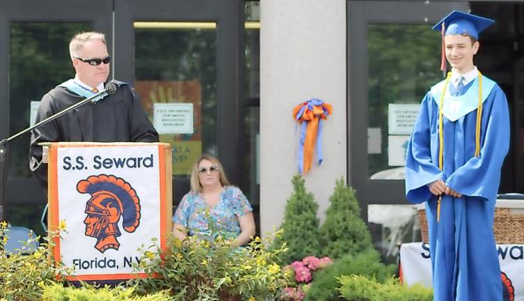 Seward Principal Michael Rheaume introduces Class of 2021 valedictorian Bradley Vogt.