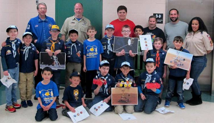 GWL Cub Scout Park 121 goes 'Out of this World' to celebrate Earth Day Photos by Ed Bailey Adults, standing left to right with members of all from Cub Scout Pack 121 in Greenwood Lake, are: John Huibregtse, instructor from Lower Hudson Valley Challenger Center; Jason Fox, Pack 121 NOVA Committee co-chair; Victor Pignataro, Project Lead the Way Teacher of GWL Middle School; Alex Vinnelli, Project Lead the Way Teacher of GWL Middle School; and Charlene Carlo, Den 12 Leader and Pack 121 NOVA Committee Co- Chair.