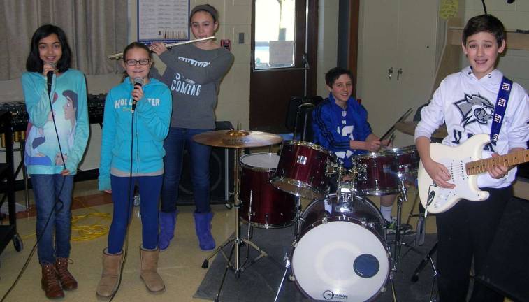 Warwick's own 'School of Rock' Photo provided by Darryl Wilbur Members of the Warwick Valley Middle School Guitar Club rehearse for their upcoming concert. Pictured left to right: vocalists Arianna Mendez and Emma Kardell, flute player Ashley Emanuel, drummer Granger Ottley and lead guitarist Connor Borthwick.