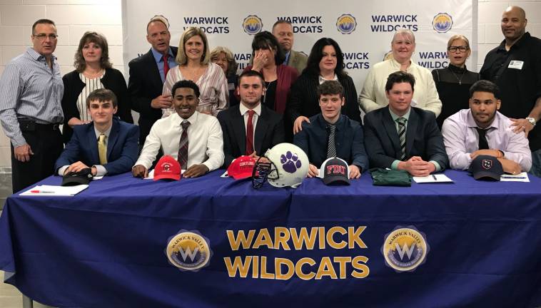 College-bound Photo provided by Gregory Sirico Six Warwick Valley High School seniors signed letters of commitment to play college football in the fall of 2019 on Friday, May 3. Pictured from left to right with their parents, the athletes and their college destinations are: Nicky Garcia (Hartwick College), Gregory Sirico (Cortland State), Rob Maslanka (Cortland State), Kyle Rooney (FDU), Grant Dolshun (Morrisville State) and Andre Ward (Western Connecticut State).