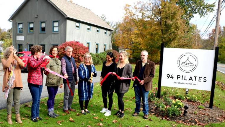 On Friday, October 29,Town of Warwick Supervisor Michael Sweeton (right) and members of the Warwick Valley Chamber of Commerce joined Barbara Sullivan (center), her husband, Steve, and her staff to celebrate the official grand opening of 94 Pilates with a ribbon cutting ceremony.