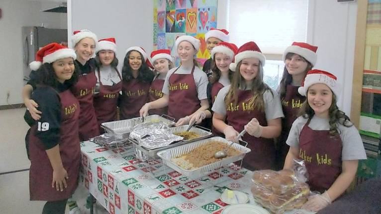 On Friday Dec. 11, a youth singing group called Laker Kids sang Christmas Carols to the seniors at the Greenwood Lake Senior Center. The seventh grade students started the club on their own two years ago. They also served lunch to the seniors. The club raises money for the community and charities such as food pantry, Easter egg hunt and Backpack Stack Attack to name a few.