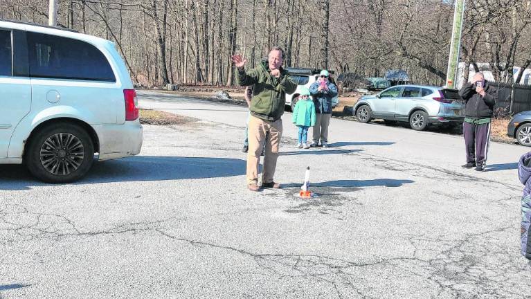 NASA ambassador Jim Hall fires up a toy rocket using a mixture of vinegar and baking soda Saturday, Feb. 24 outside the Greenwood Lake Elks Lodge. (Photo by Kathy Shwiff)