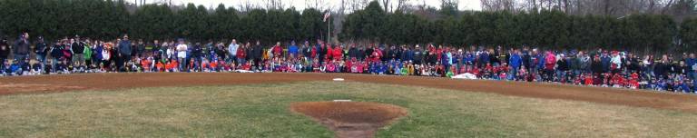 Warwick Little League celebrates opening day for 2014 baseball season Everyone assembled in one of the ball fields at Veterans Memorial Park.