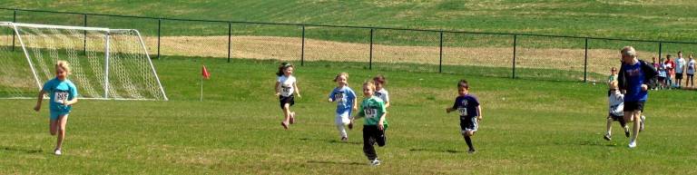 St. Stephen’s - St. Edward’s Elementary School hosts 5K run for technology Photos by Roger Gavan The 100-yard dash for kids aged six and younger.