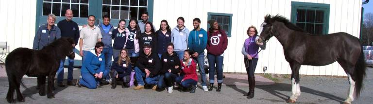 Photo by Roger Gavan Eighteen first- and second-year medical students from The Touro College of Osteopathic Medicine in Middletown along with their professor, Dr. Alex Joanow (second from left), Director of Development Deirdre Hamling (far right) and staff recently enjoyed an unusual and intriguing afternoon at Raven Hill Farms, a local horse farm in the Town of Warwick.