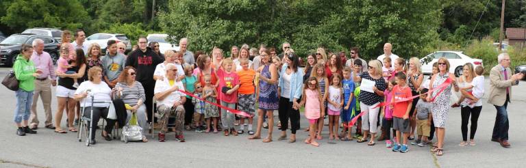 Preschool Solutions celebrates new building with ribbon-cutting ceremony Photo by Roger Gavan On Sept. 5, members of the Warwick Valley Chamber of Commerce joined Preschool Solutions Director Laura Stubecki (center), her close family, staff and preschool families for a ribbon-cutting to celebrate the school's new building and grand opening at 1406 Kings Highway in Sugar Loaf.