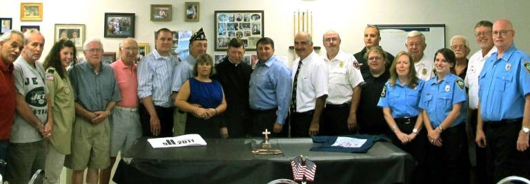Greenwood Lake observes Sept. 11 Among the guests attending the Sept. 11 service at the Greenwood Lake Senior Center were Mayor Jesse Dwyer, Warwick Town Councilman Floyd DeAngelo, GWL Senior Center Director Suzanne Joyce, the Rev. Robert Sweeney of Church of the Holy Rosary, Village Attorney John Buckheit and members of the police department, fire department, ambulance corps and the Elks.