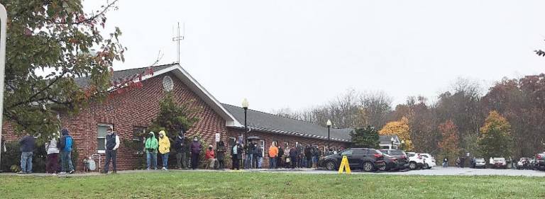 Early Monday evening, it took about 70 minutes from the time voters left their vehicles to the time they cast their ballots.