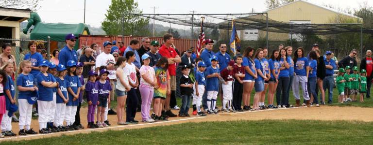 Florida celebrates half a century of playing ball Players, coaches, friends and families listen to remarks during the opening day ceremonies of the Florida Little League.