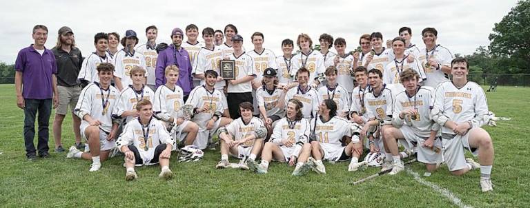 The champion Wildcats and their head coach Coach Tom Kelly pose for a team photo with with their first-place plaque and medals. Photos by Henry Smith/American Image News Service.