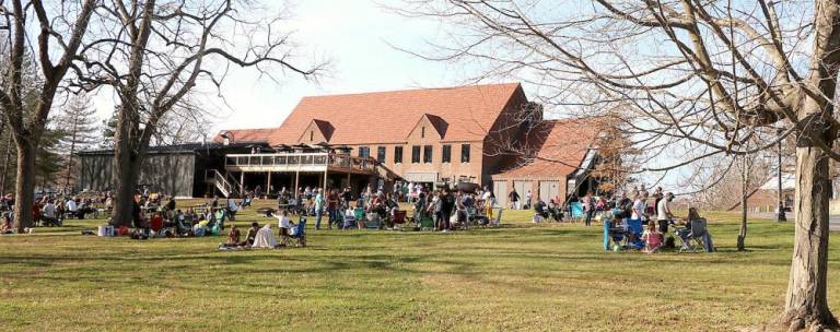 Crowds enjoy the mild weather and refreshments outside the popular Drowned Lands Brewery on the grounds of the former Mid-Orange Correctional facility in Warwick.