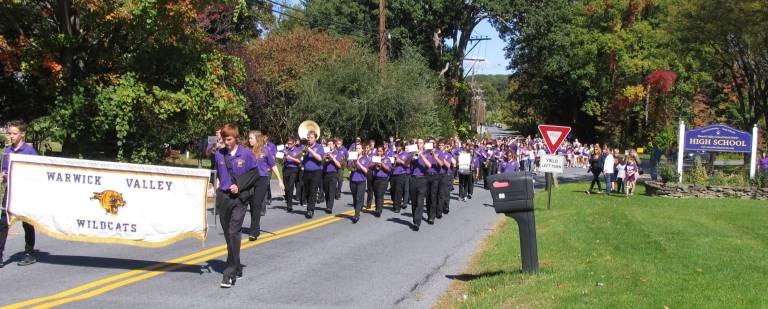 Homecoming Day events precede a Wildcat victory over the Kingston Tigers The spirited and award winning Wildcat Marching Band lead the line of march along West Street Extension and onto Sanfordville Road, where the marchers entered the high school grounds and onto the football field. Students were encouraged to march with their team, club, group or class. Many parents, alumni and supporters lined the field entrance to cheer them on.