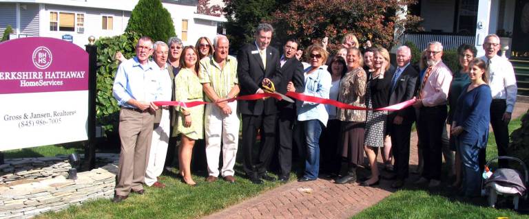 Berkshire Hathaway opens office in Warwick Photo by Roger Gavan On Oct. 18, Town of Warwick Supervisor Michael Sweeton (far left), Mayor Michael Newhard (far right) and members of the Warwick Valley Chamber of Commerce Board of Directors joined Broker/President Kevin J. Colman (center left) and partner Luca Hans Alboretti (center right), their agents, staff and associates to celebrate the grand opening of a new office at 23 Oakland Ave. in Warwick.