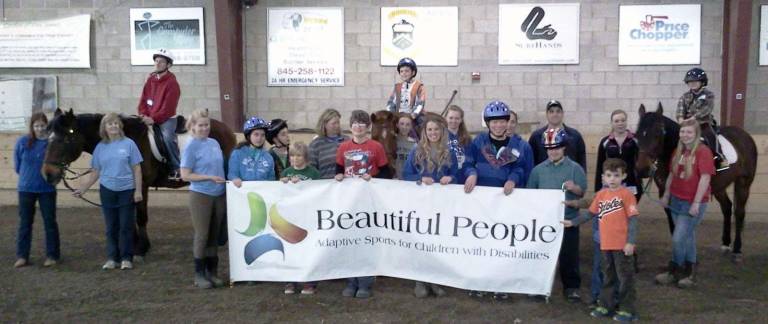 Some 'Beautiful People' made a stop at Winslow Beautiful People kids were back riding at Winslow again this year. They are pictured here with Winslow volunteers.