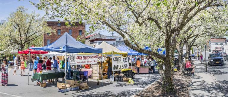 Crowds welcome the opening of the Warwick Farmer's Market Photo by Robert G. Breese A panoramic image of the farmers market on Sunday afternoon with the blossoming trees along South Street. Additional photos appear online at warwickadvertiser.com.