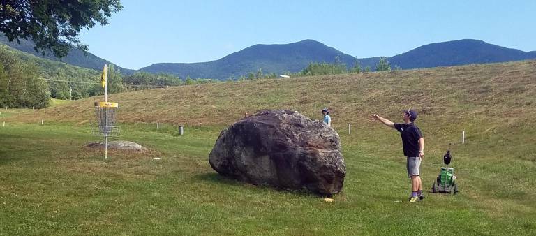 Zack Doyle's successful putt for Par 3 in the final round on Hole #9 of the FOX Run course. It was a difficult putt because Zack couldn't see the basket due to the height of the boulder.