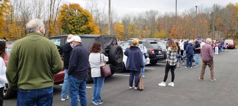 Voters wait on line Saturday morning at Monroe Town Hall to cast their votes. Photos by Nancy Kriz.