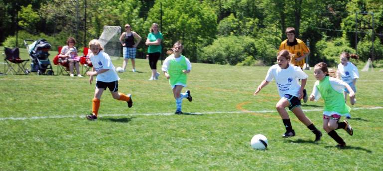 Warwick Soccer Club hosts first club tournament Each fall the Warwick Soccer Club sponsors a new team in both the U9 boys and U9 girls division to introduce the player and their families to the higher level of competition and commitment required in Travel soccer. Tryouts are held in May and teams are formed in early June for the following fall season.