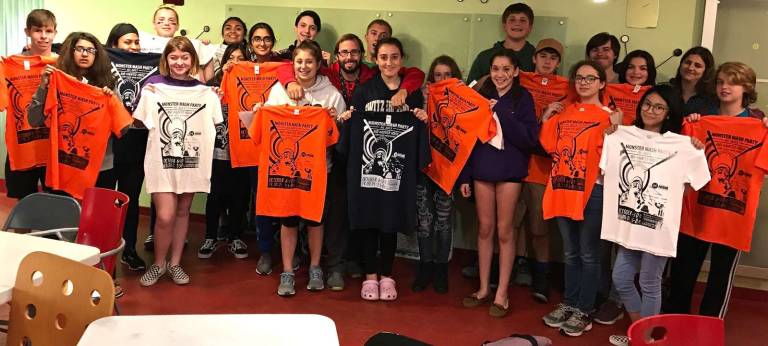 ShockFry: Area 990 Youth Advisory Board members showing off their screen printed shirts.