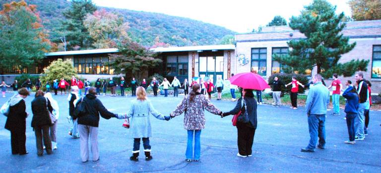 Tuxedo is back; GWL now has a three school parental choice option GWL board votes to reinstate Baker High School after Tuxedo officials submit revised $12,000 tuition rate Photo by Ed Bailey Students and some adults form a circle in front ot the Greenwood Lake Elementary School on Tuesday evening prior to the Greenwood Lake School Board meeting, where the board was expected to decide whether to include the Tuxedo School District as a choice as to where parents could send their high school-age children to in September.
