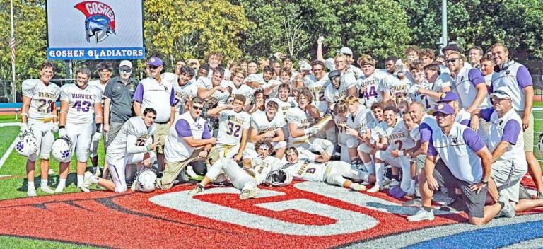 The Warwick Valley Varsity Football team, coaches and staff pose for a moment like no other following Warwick’s 20-6 victory over Goshen. Photo by Al Konikowski.