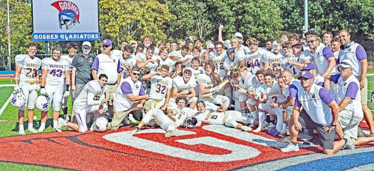 The Warwick Valley Varsity Football team, coaches and staff pose for a moment like no other following Warwick’s 20-6 victory over Goshen. Photo by Al Konikowski.