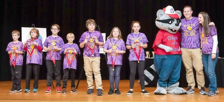 Sanfordville Elementary School's The Classics ... The Effective Detective Division 1 team is recognized with the Ranatra Fusca Creativity Award. From Left to Right: John Powers, Leonard Tosh, Chris Tyler, Ryan Kobrick, Lucas Cresser, Emily Powers, Cora Colin-Green, Coach Kevin Powers and Coach Heidi Powers.