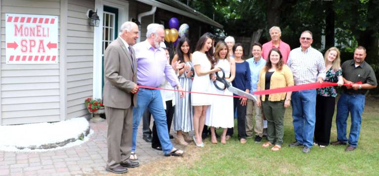 MonEli Spa in Pine Island celebrates grand opening Photo by Roger Gavan On Saturday, June 23, Orange County Legislator Paul Ruszkiewicz (right), Town of Warwick Deputy Supervisor James Gerstner (left) and members of the Pine Island Chamber of Commerce joined owners Mona and Eli Foroutani, (center) their relatives and friends for a grand opening celebration.
