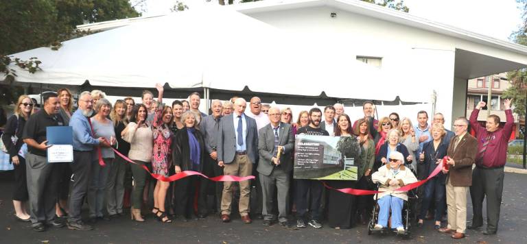 Stage and Nathans celebrates major anniversaries Photo by Roger Gavan On Oct. 12, state, county and local officials along with members of the Warwick Valley Chamber of Commerce joined Douglas R. Stage and William Nathans for a ribbon-cutting celebrating three significant anniversaries in the history of the law firm. William Nathans and Douglas Stage (center) cut the ribbon held by Mayor Michael Newhard (left) and Town of Warwick Supervisor Michael Sweeton (right).