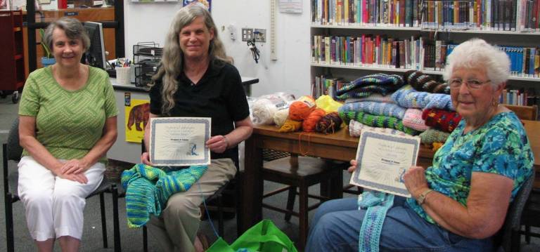 Handmade help From left to right: Florida Public Library Assistant Marie Arnstein presented Kathleen Braun and Lilly Lang with a certificate of appreciation from Project Linus.
