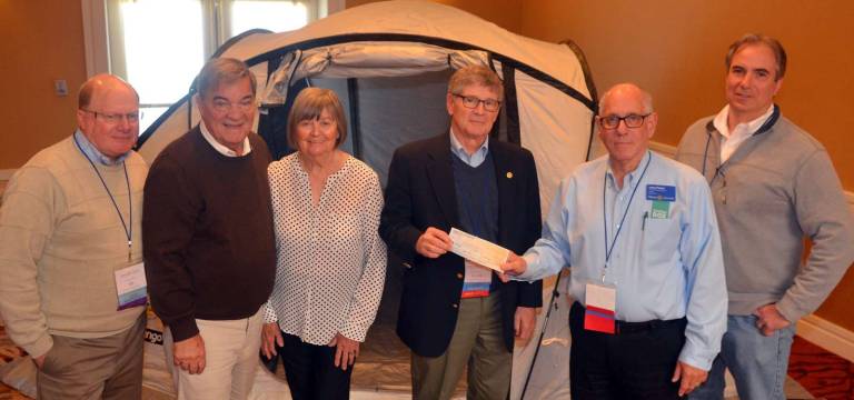 Rotarians donate to disaster relief program Rotarians donate to disaster relief program