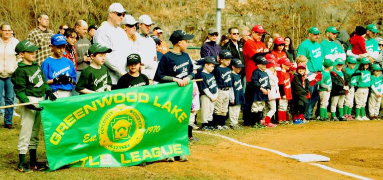 Play ball Some of the teams lined up on the field during openin day ceremonies.