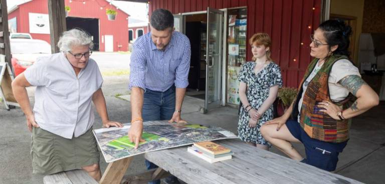 U.S. Rep. Pat Ryan speaks with Bea Stern, chairman of the Board of the Chester Agricultural Center, and tours the center alongside some of the Center’s farmers. Provided photos.