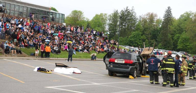 'This is not entertainment' Photos by Roger Gavan Warwick Valley High School students had front row seats Tuesday morning, May 2, during mock automobile crash in the parking lot between the high school and the middle school. The crash was meant to show students that their decisions matter.