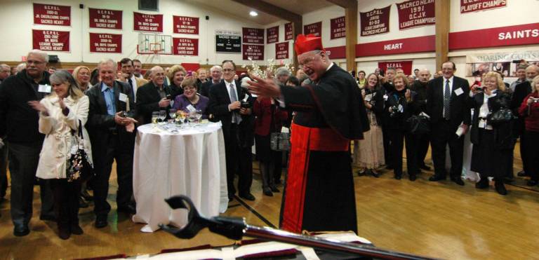Catholics call their new cardinal a breath of fresh air Photo by Ed Bailey Cardinal Timothy Dolan shares his thanks to a group of musicians from Monroe-Woodbury High School who played during the archbishop's reception with the faithful at Sacred Heart Parish in Monroe.
